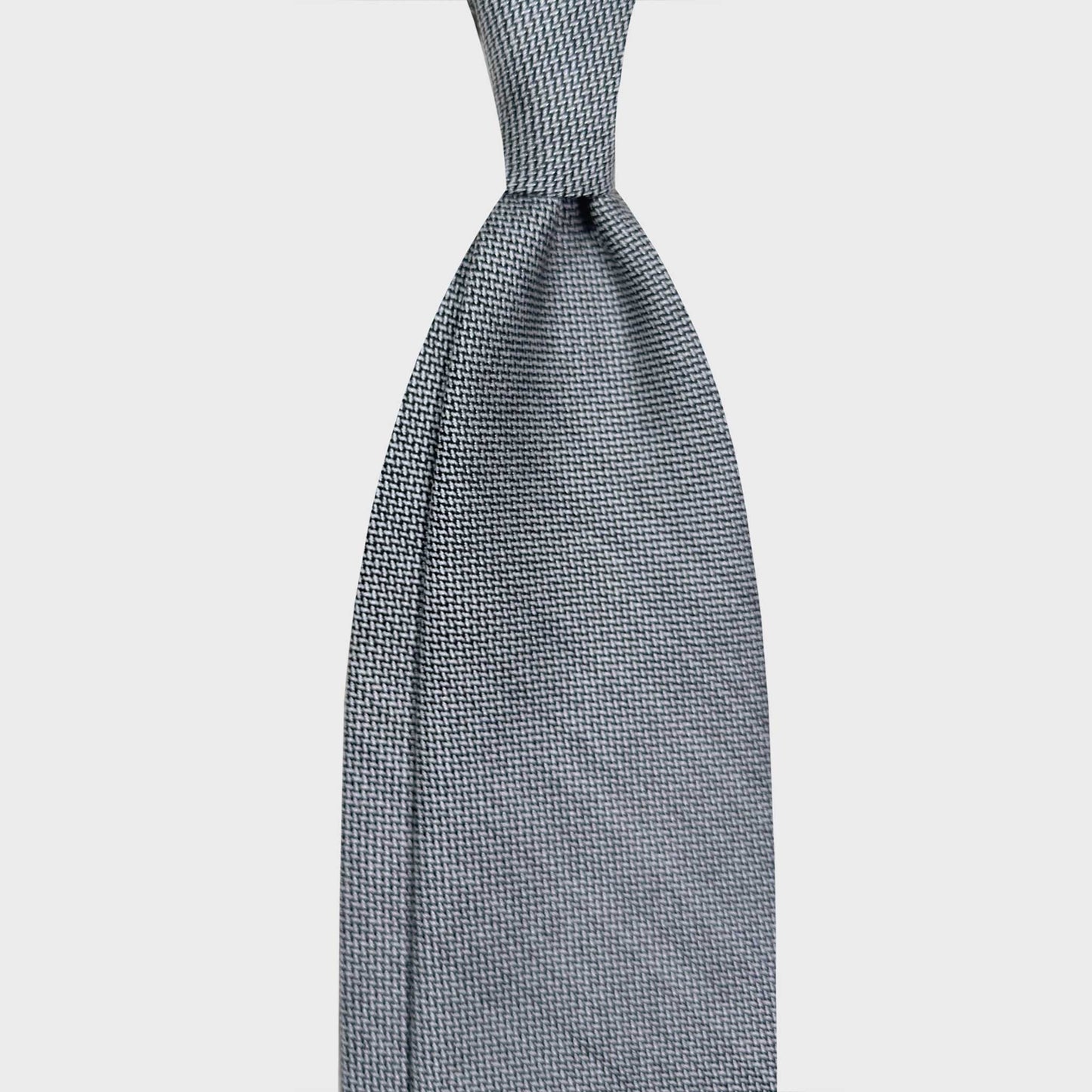 Every Seasons Silver Grey Wool Tie Canvas Pattern. Exclusive silver gray wool tie made in Italy with light wool extra fine canvas pattern, discover classic ties for every seasons at the men's tie shop in Geneva