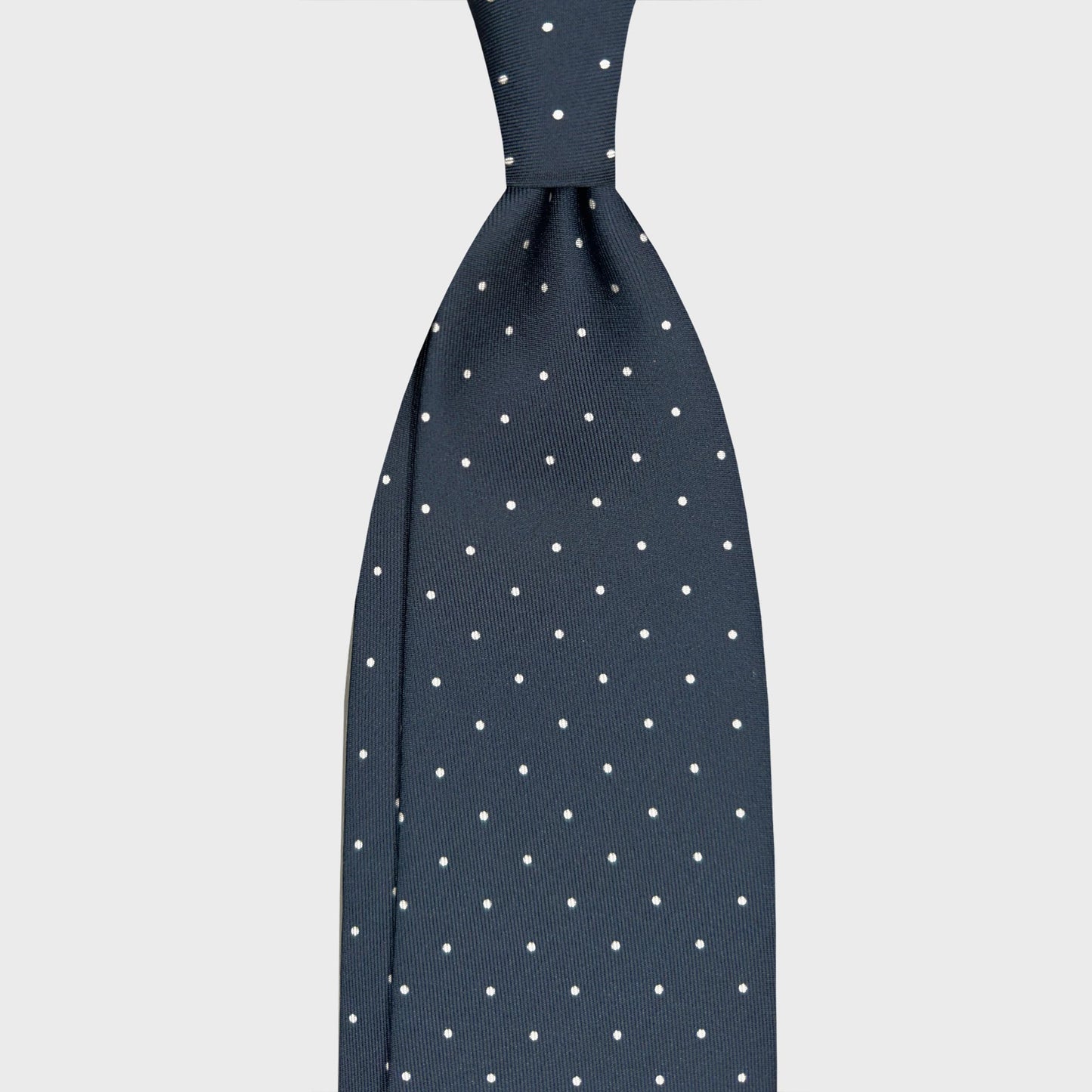 Steel Blue Pois Men's Ties Geneva Switzerland. Steel blue polka dot silk tie, designed by Wools Boutique Uomo, handmade in Italy. Ideal for refined tailoring clothing, business attire and elegant menswear.