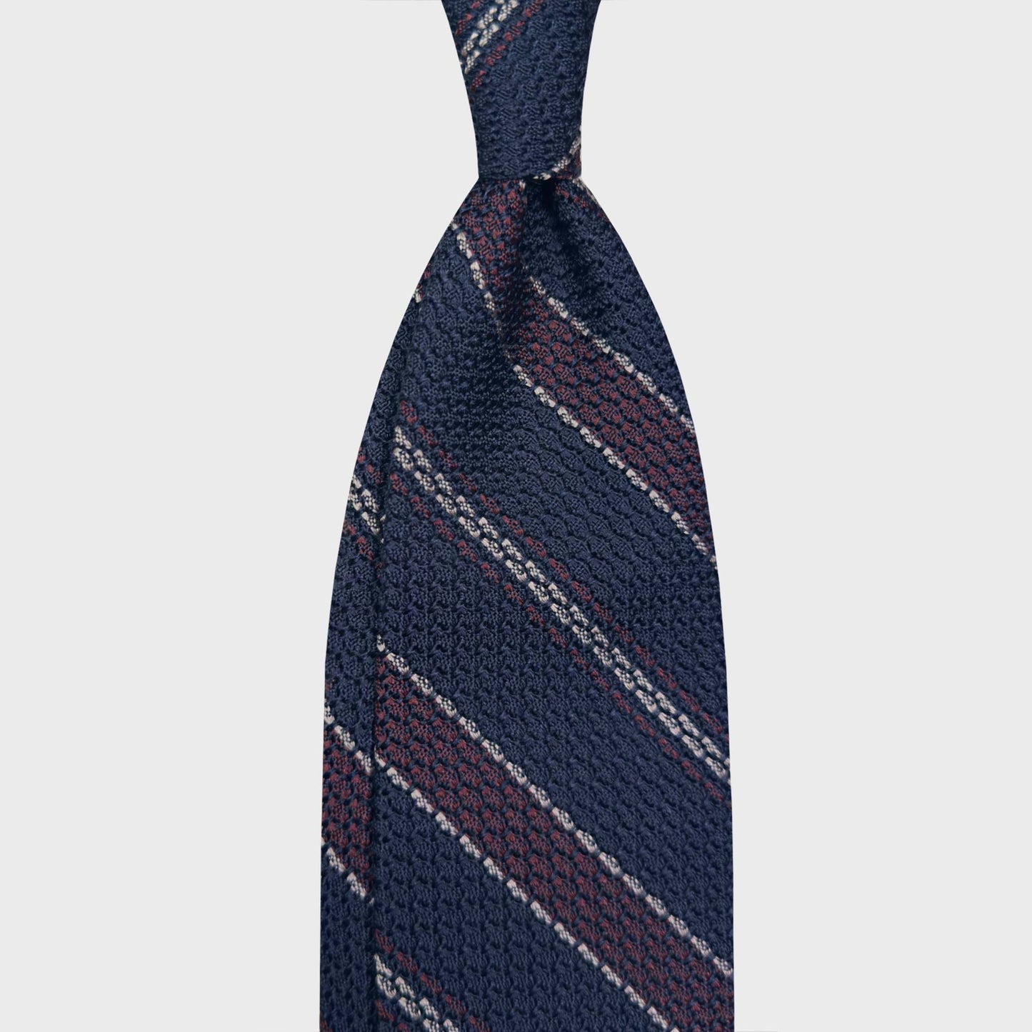 Navy Burgundy Regimental Silk Tie Grenadine Large Gauze. Classic large gauze grenadine silk tie, hand made striped tie exclusive for men's tie store Wools Boutique Uomo Geneva, navy blue striped regimental ties