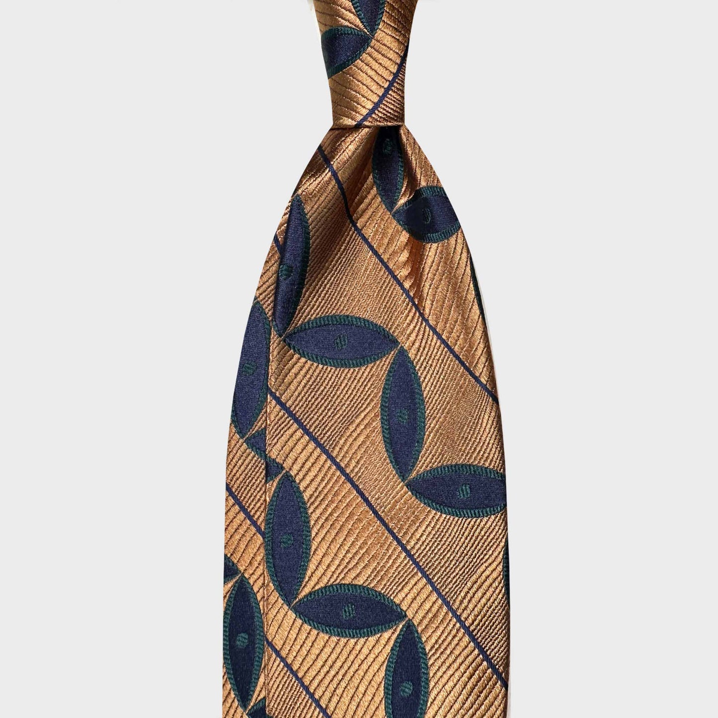 Yellow gold silk tie featuring a deco striped leaves pattern in navy blue and grass green tones. A bold yet elegant design with refined satin texture, ideal for distinctive business and formal menswear.