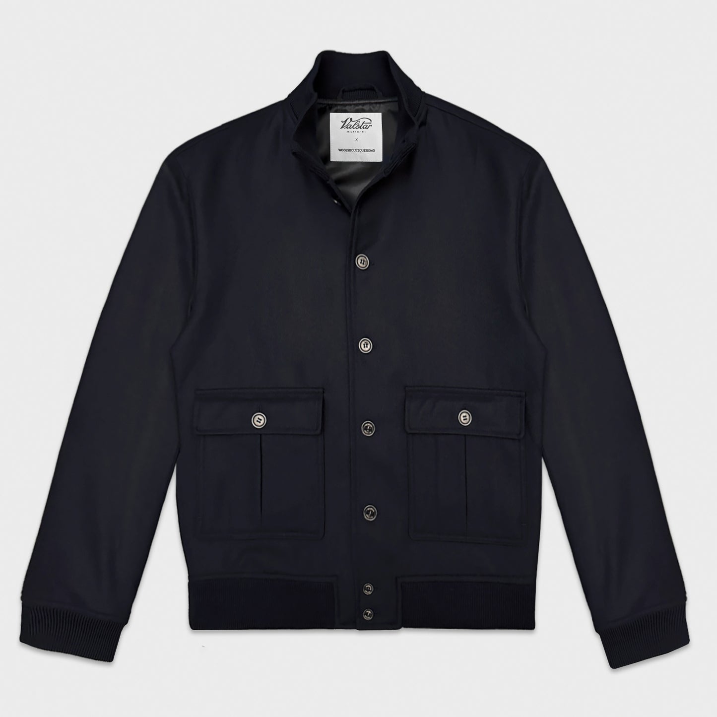 Navy Wool Valstarino Jacket Valstar x Wools Boutique Uomo. Capsule collection of a classic wool bomber jacket with the design of the iconic Valstarino using a refined flannel wool fabric made by Taylor & Lodge UK, lined inside, navy blue color.