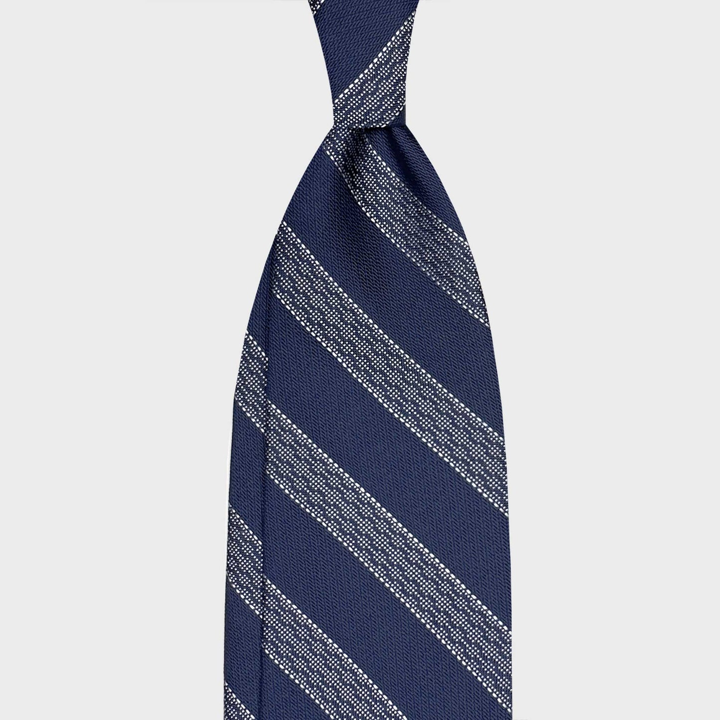 Regimental Panama Silk Tie Indigo Blue White. Discover refined italian ties in Geneva with this Wools Boutique Uomo regimental silk tie in indigo blue and white. A timeless and elegant design in soft silk.