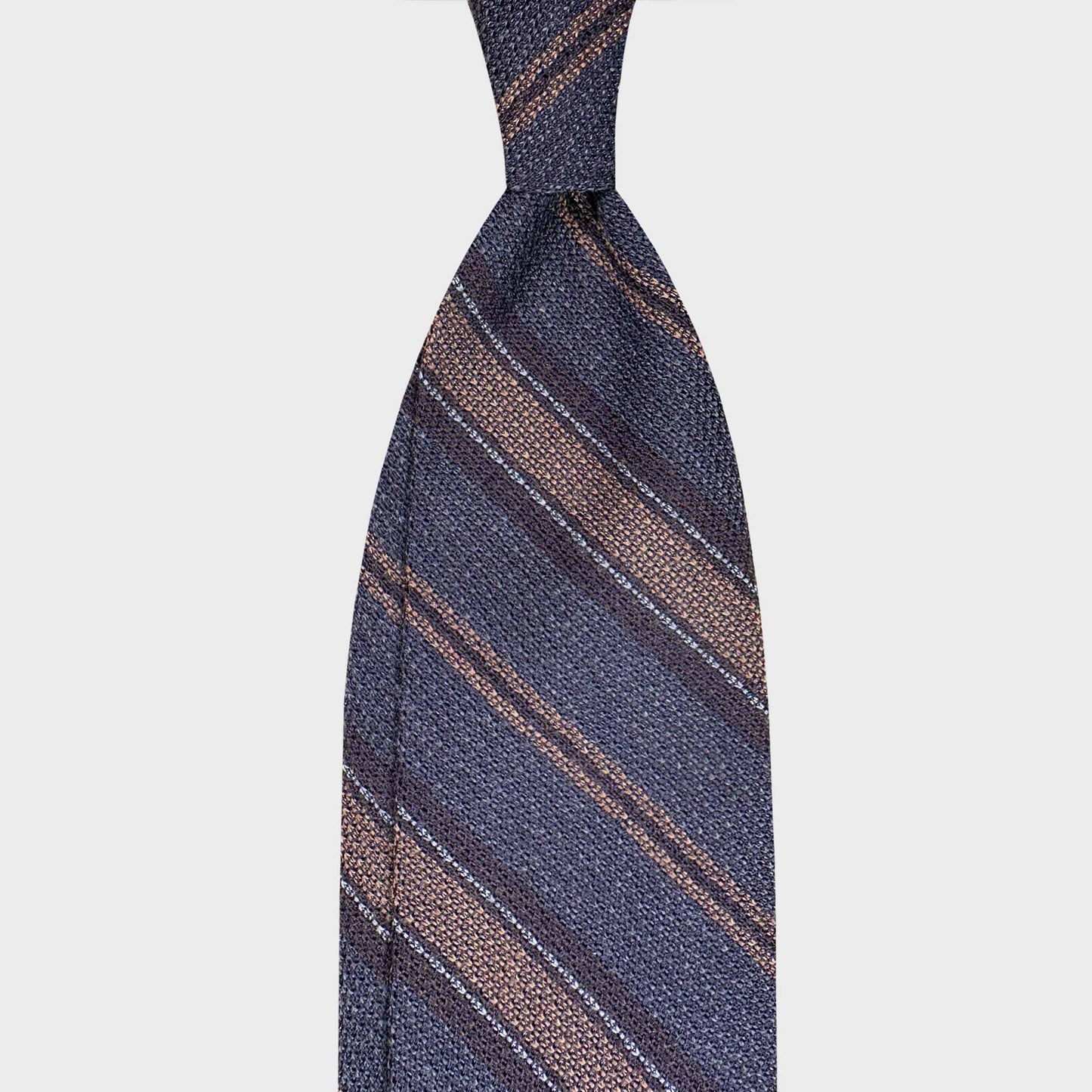 Handmade F.Marino grenadine silk regimental tie in indigo blue with camel and silver stripes. Crafted in Naples for Wools Boutique Uomo Geneva.