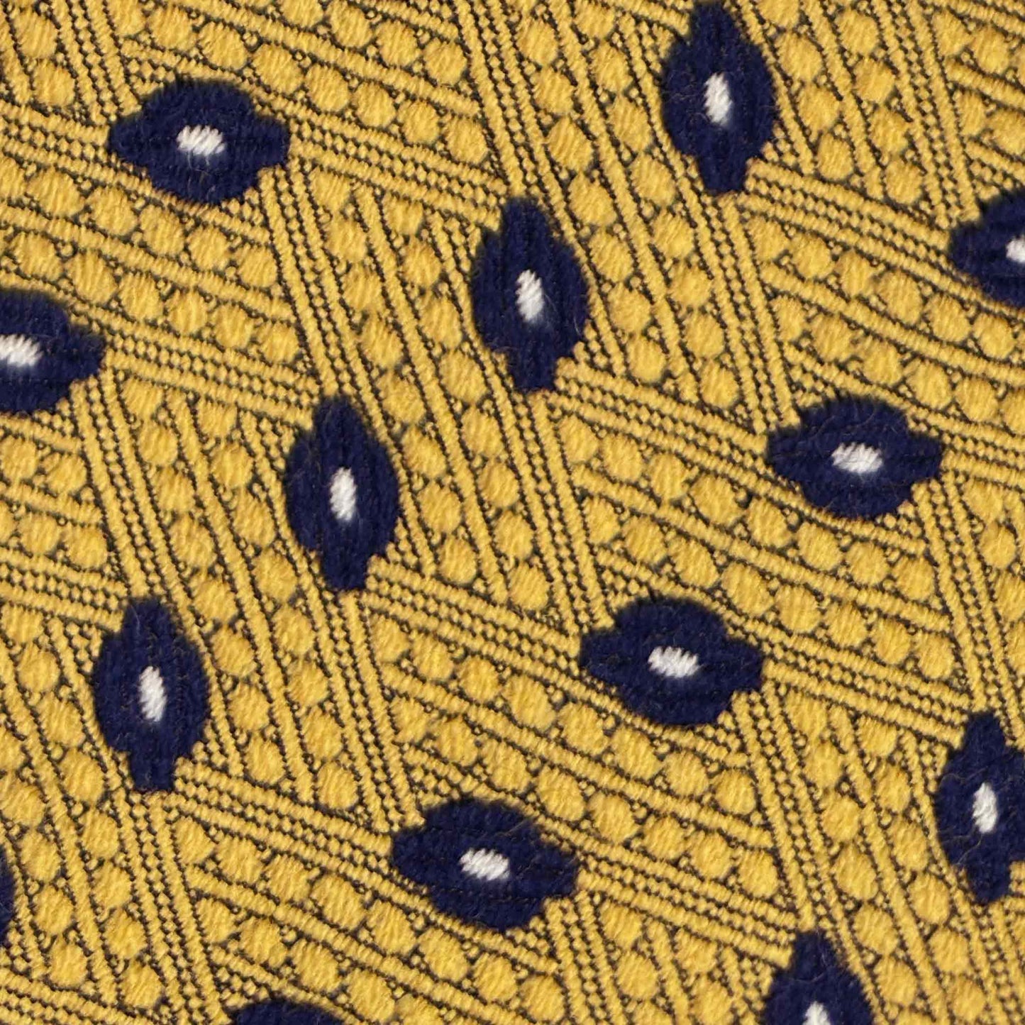 Detail of navy diamond pattern on golden yellow wool tie