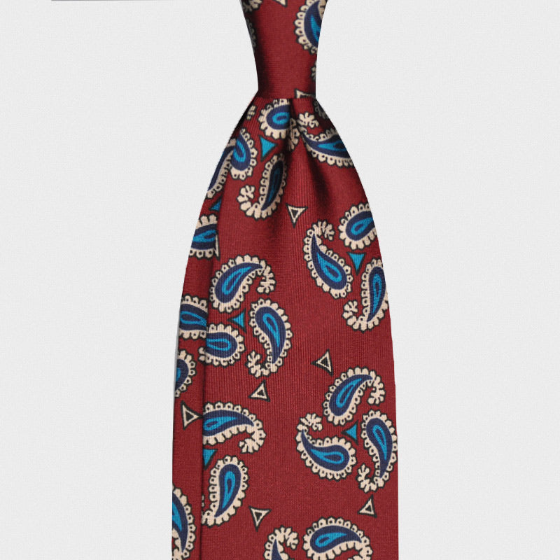 Paisley Cherry Red Silk Tie 3 Folds Unlined Handmade. Red silk tie with turquoise paisley pattern, handmade tie in Italy by F.Marino Napoli exclusive for Wools Boutique Uomo, hand rolled edge, unlined.